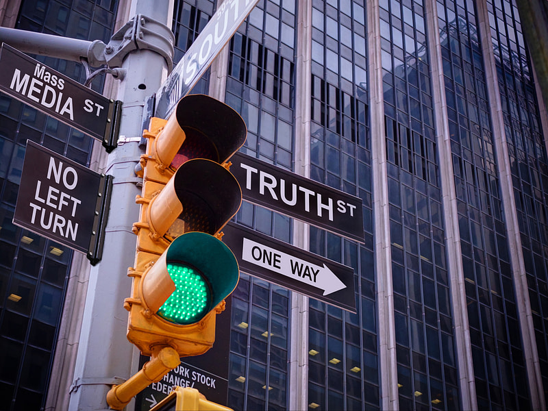 traffic light on street truth or mass media news and current events v-cast
